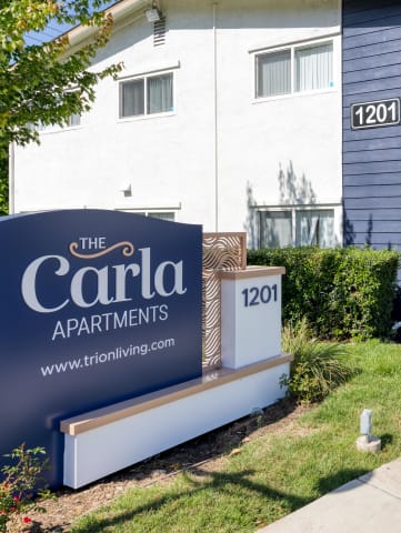 a building with a sign that says the carolina apartments