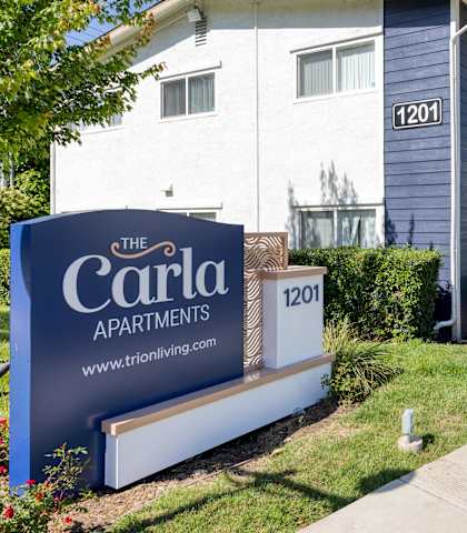 a building with a sign that says the carolina apartments
