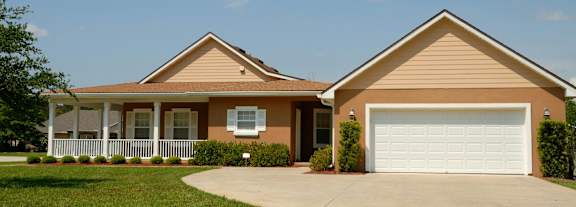 a house with a driveway and a garage door