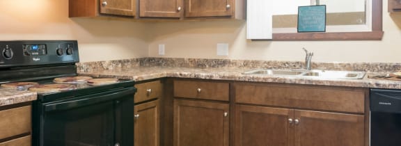 Bismarck, ND Highland Meadows|Kitchen with Black Appliances