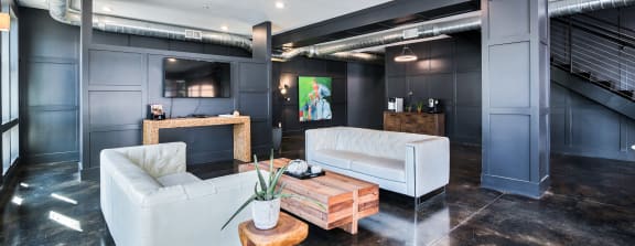 a living room filled with furniture and a fire place