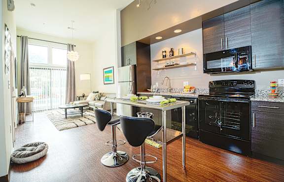 Luxury Vinyl Plank Flooring In Kitchen And Living Room at Link Apartments® Canvas, Atlanta, GA, 30312