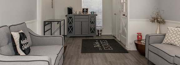 a dining room and living room with a table and chairs
