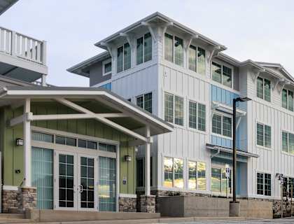A row of modern buildings with blue and white trim.