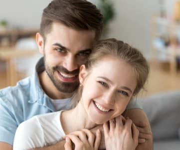 Couple Embracing in Living Room