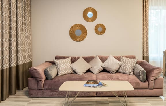 a living room with a couch and a table