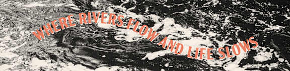 A black and white image of a river with the text "Where rivers flow and life slows".