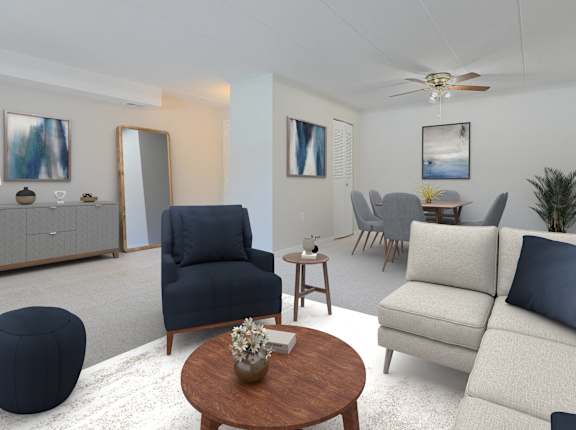 A living room with a blue chair and a white couch.