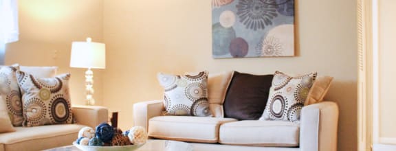 a living room with a couch and a table at Oakwood Apartments, Florence, KY, 41042