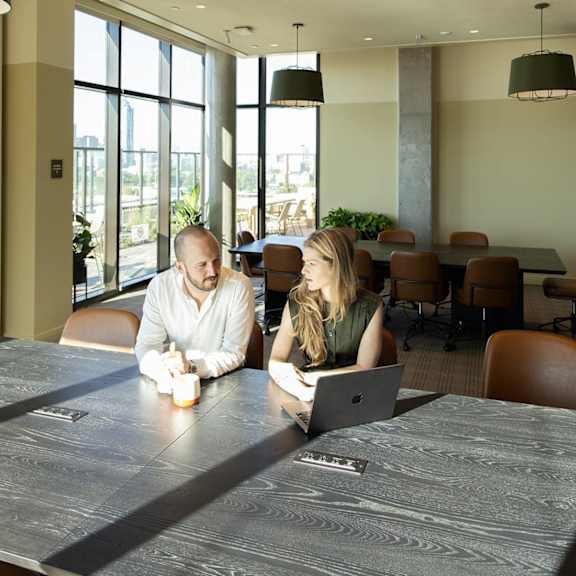 Two People sitting at conference room table1 at Scout Living, powered by Placemakr, Atlanta, GA
