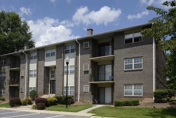 Front Exterior with off street parking for residents and guests at Deer Park Apartments, Randallstown