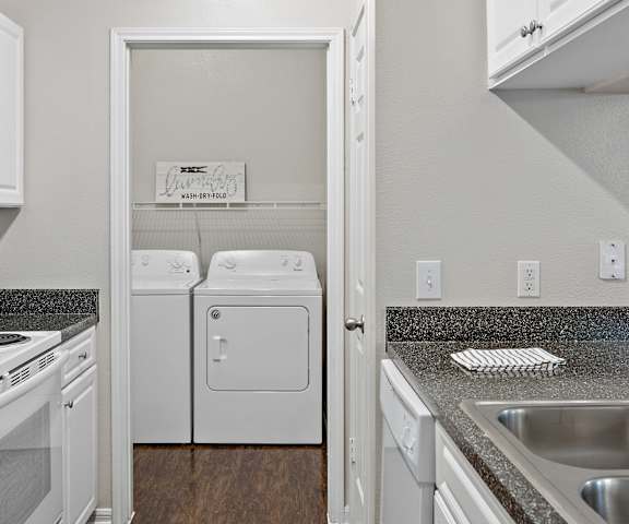 a kitchen with white appliances and granite countertops at Ventana Oaks Apartments, Austin, TX, 78717