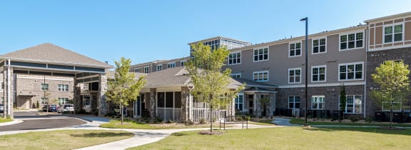 a large lawn in front of a building with grass