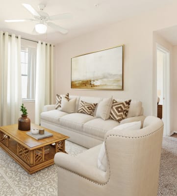 a living room with a white couch and a coffee table