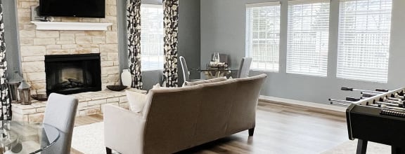 a living room with a couch and a table at Brookfield Village Apartments, Ohio, 43123
