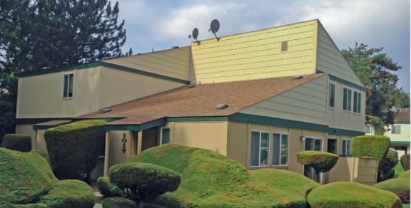 La Verde Apartments Building Exterior with Landscaping and Trees