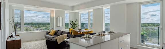 A modern kitchen with a view of the city.