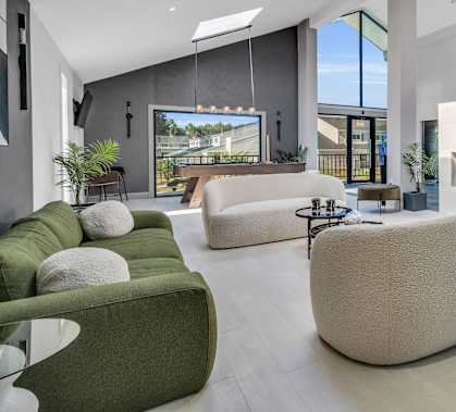 a living room with couches and chairs and a fireplace Townhomes at Gateway, Bensalem, Pennsylvania