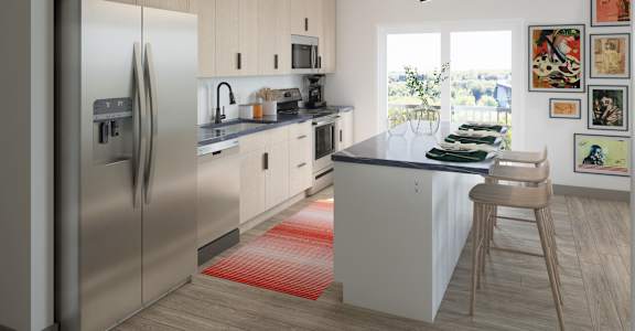 A modern kitchen with a refrigerator, sink, and a dining table.