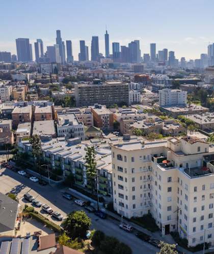 the city skyline with buildings and a parking lot