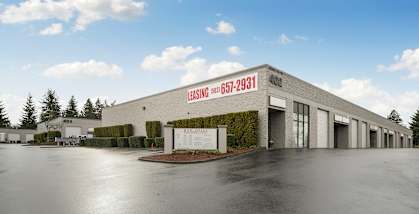Red Soils Business Park exterior building, directory, and leasing banner 