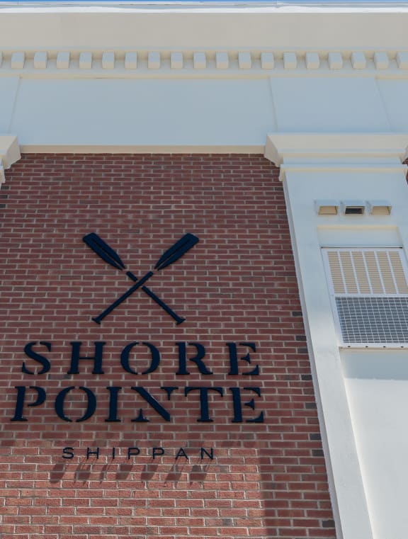 a sign on the side of a building that reads shore point