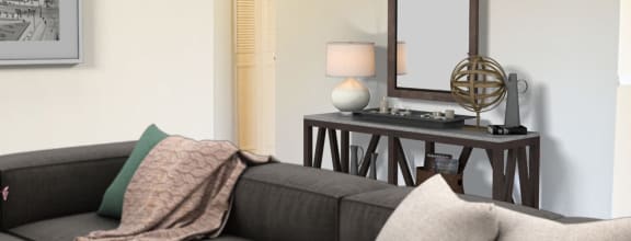 a living room with a couch and a table and a fireplace at Timber Ridge Apartments, Cincinnati, Ohio