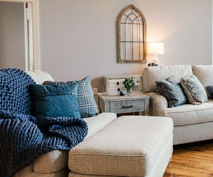 a living room filled with furniture and a large window