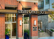 Thumbnail 19 of 22 - Liberty Gateway Apartments, Salt Lake City, Utah, exterior with a leasing office sign on the front.