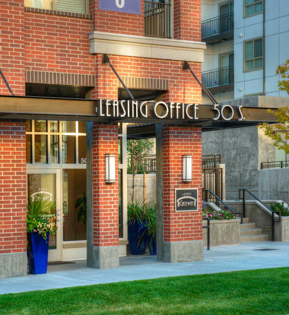 Liberty Gateway Apartments, Salt Lake City, Utah, exterior with a leasing office sign on the front.