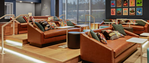 a living room with a large window and a television