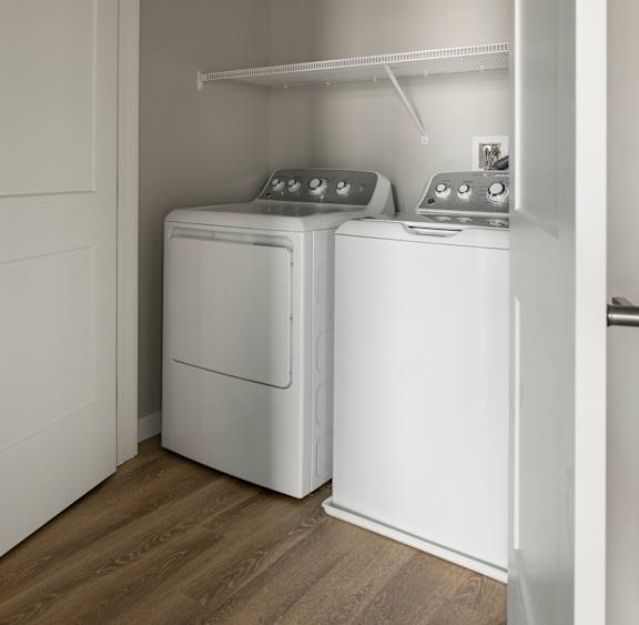 A laundry room with a washer and dryer.