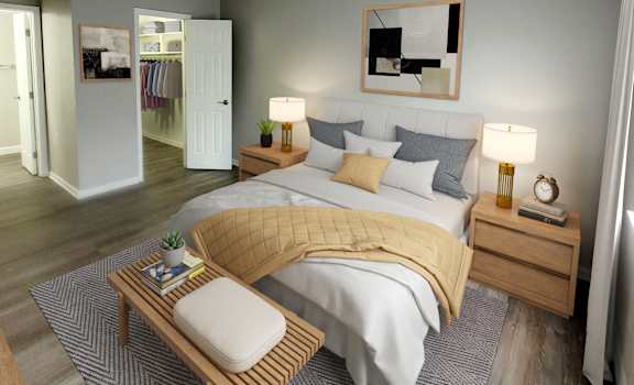 a bedroom with a large bed and two night stands with lamps on them