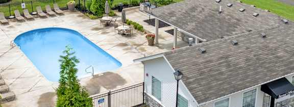 A house with a pool in the backyard.