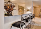 Thumbnail 7 of 25 - Kitchen bar with bar stools at The Sanctuary of Lake Villa, Illinois, 60046