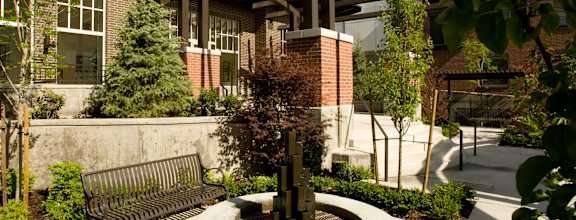 A courtyard with a fountain and benches.