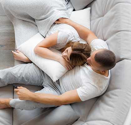 Couple lounging on couch