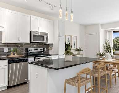 Kitchen with counter and chairs at Elements of Linden Hills, Minneapolis