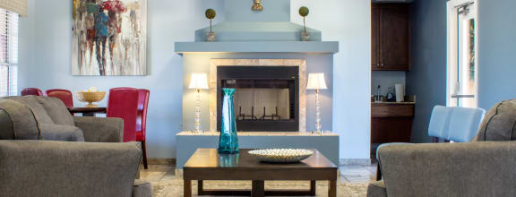 a living room filled with furniture and a fire place