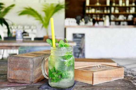 a cocktail in a on a wooden table