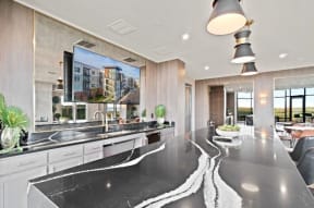 a kitchen with a large counter top and a large window