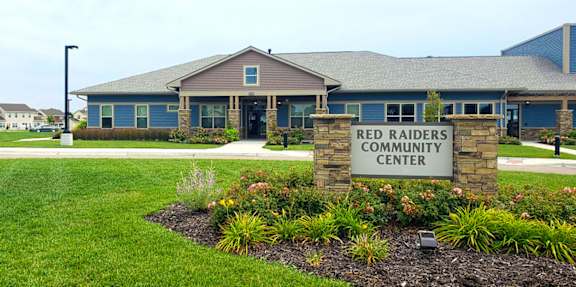 A building with a sign that says Red Raiders Community Center.