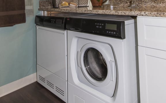 a washer and dryer in a bathroom with a counter top and a sink at Valley Plaza Villages, Pleasanton, 94566