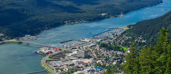 river through the mountains and town at TRILLIUM LANDING, JUNEAU, AK 99801