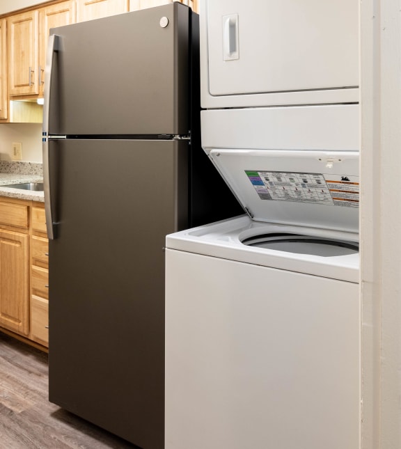a kitchen with a refrigerator and a dishwasher at Charlesgate Apartments, Maryland, 21204