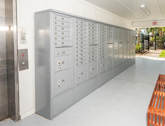 a locker room with a bench and some lockers at The Teale, Kissimmee, FL, 34746