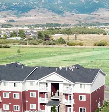 Apartment buildings with mountainous background.