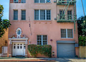 Thumbnail 1 of 6 - Main entrance exterior with parking garage