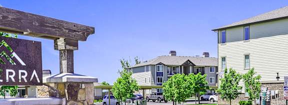 A sign that says "RRA" is in front of a building.