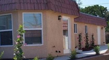 Limoncello Apartments exterior building and grass lawn